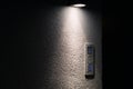 Old door bell with intercom illuminated at night, close up Royalty Free Stock Photo