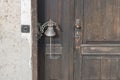 Old door bell on an old wooden door