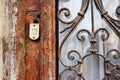 Old door bell on the vintage dirty door Royalty Free Stock Photo