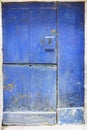 Old door of blue wood divided into three parts and with lock in Royalty Free Stock Photo