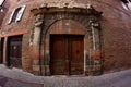 Old Door in a Brick Building