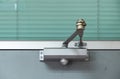 Old door closer. Royalty Free Stock Photo