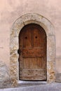 Old door with eroded stone arch Royalty Free Stock Photo