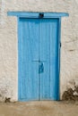 Old door of a farm or rural house painted blue Royalty Free Stock Photo