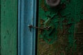 old door with flattened green and blue paint Royalty Free Stock Photo