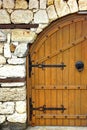 Old Door or Gate in White Stone Wall Royalty Free Stock Photo