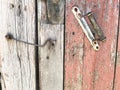 Old door handle and hook for closing doors Royalty Free Stock Photo