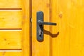 Old Door Handle With Lock On The Wooden Door. Close Up View