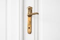 Old door handle on white door Royalty Free Stock Photo