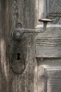 Old door handle on wooden door Royalty Free Stock Photo