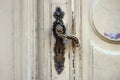 Old door handle. Wooden entrance door with antique door handles. Selective focus Royalty Free Stock Photo