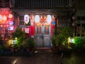 Old Door illuminated by traditional chinese style lanterns Royalty Free Stock Photo