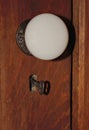 Old door knob with skeleton key Royalty Free Stock Photo