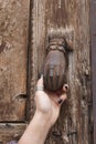 Old door knobs and hand Royalty Free Stock Photo