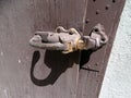 An old door latch mounted on a wooden gate in a Old Idaho Penitentiary Royalty Free Stock Photo