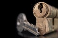 A old door lock on a dark background. A patent and keys to secure the front door Royalty Free Stock Photo