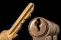 A old door lock on a dark background. A patent and keys to secure the front door Royalty Free Stock Photo