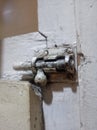 Old door lock and exposed to white paint