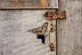 An old door with a pad for attaching the lock, background. Royalty Free Stock Photo