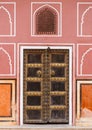 Old door in palace with pink walls in Jaipur, India Royalty Free Stock Photo