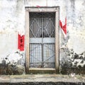 Weathered Door with Chinese Words on the Wall