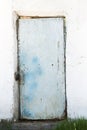 Old door on a white wall Royalty Free Stock Photo