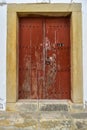 Old door in a white wall Royalty Free Stock Photo