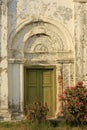 Old door, white walls, Rome style. Royalty Free Stock Photo