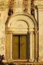 Old door, white walls, Rome style. Royalty Free Stock Photo