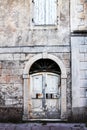 Old door and window on a stone Mediterranean house Royalty Free Stock Photo