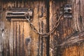 Old door, wood texture, metal latch lock. Royalty Free Stock Photo