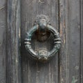 Old doorhandle on green wooden door Royalty Free Stock Photo