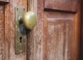 Old Doorknob with keyhole on wooden door Royalty Free Stock Photo