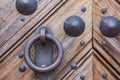 Old doorknob on a wooden door in the castle Royalty Free Stock Photo