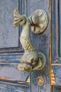 Old doorknocker in the form of a fish Royalty Free Stock Photo