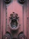 Old doorknocker on pink door Royalty Free Stock Photo