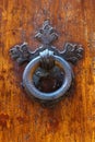 Old doorknocker at a Tuscan door Royalty Free Stock Photo