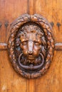 Old doorknocker at a wooden door in Aix-en-Provence Royalty Free Stock Photo