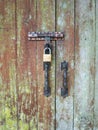 Old doors are locked with a key. Royalty Free Stock Photo