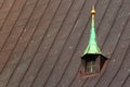 Old dorm window in metal roof of a church Royalty Free Stock Photo