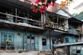 Old downgrade residence area on slopes, ancient wooden house in cyan at Da Lat, Vietnam