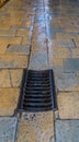 Old medieval drain and stone covered street