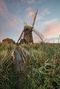 Old drainage windpump windmill in English countryside landscape Royalty Free Stock Photo