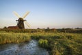 Old drainage windpump windmill in English countryside landscape Royalty Free Stock Photo