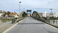 Old draw bridge over the Sado River, view from the left bank approach, Alcacer do Sal, Portugal Royalty Free Stock Photo