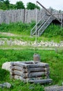 Old draw well with wooden bucket Royalty Free Stock Photo