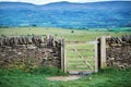 Old dry stone wall in welsh countryside, mountains in background Royalty Free Stock Photo