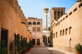 Old Dubai view with mosque, buildings and traditional Arabian street. Historical Al Fahidi neighbourhood, Al Bastakiya. Royalty Free Stock Photo