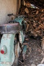 Old durty motor wirh split wood as background