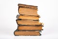 Old dusty books on a light countertop. Library items in old bindings